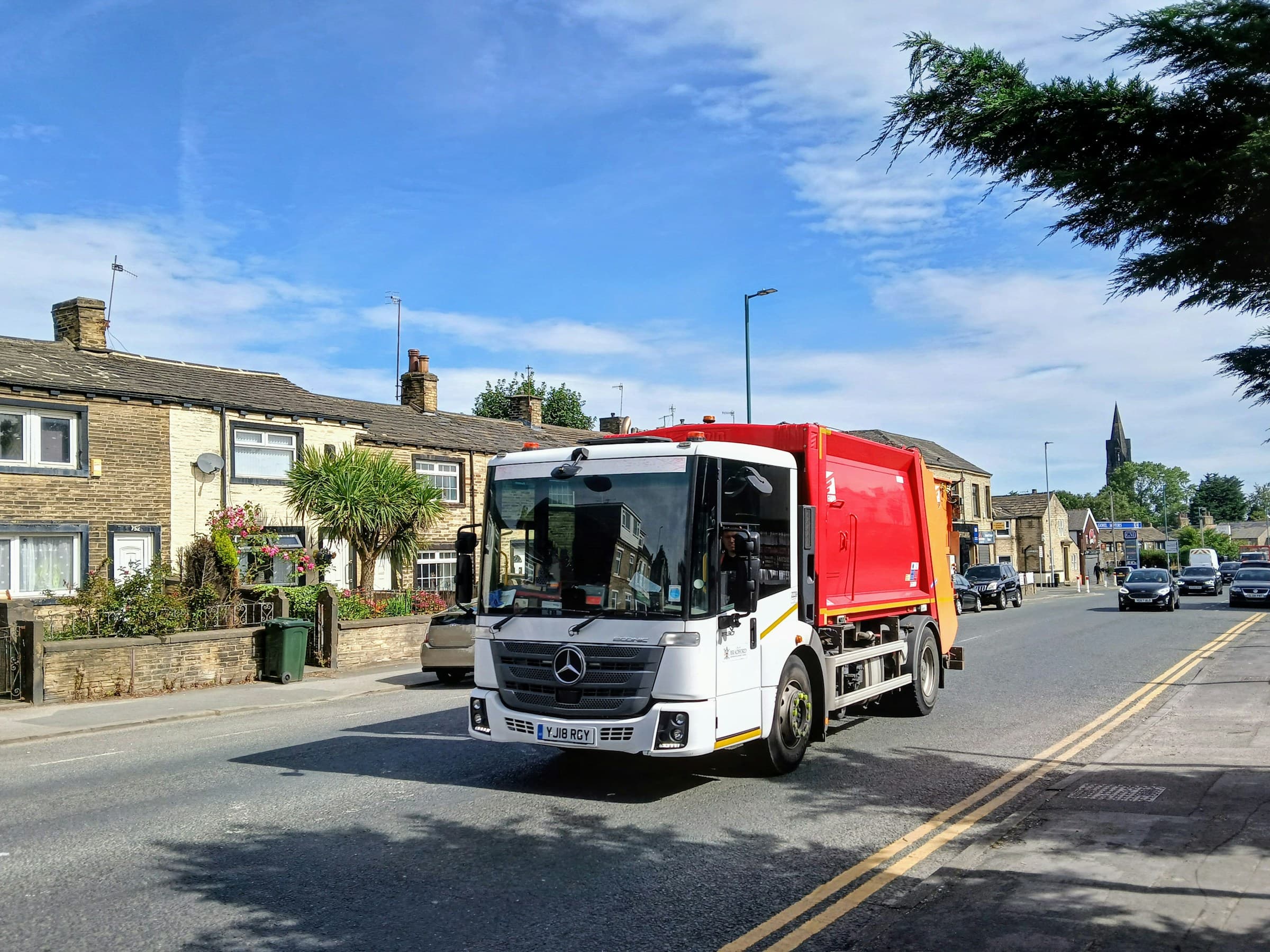 A Van-Go collection truck on the road